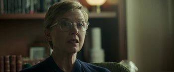 Movie still from “Life Itself” (2018), directed by Dan Fogelman – An older woman wearing glasses sitting in a chair; Close Up shot, Over the shoulder angle