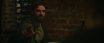 Movie still from “Life Itself” (2018), directed by Dan Fogelman – A bearded man sitting in front of a red brick wall; Close Up shot, Over the shoulder angle