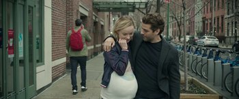 Movie still from “Life Itself” (2018), directed by Dan Fogelman – A man and a pregnant woman walking down a sidewalk; Medium shot, Over the shoulder angle