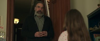 Movie still from “Life Itself” (2018), directed by Dan Fogelman – An older man with a goatee and beard talking to a young girl; Medium shot, Over the shoulder angle