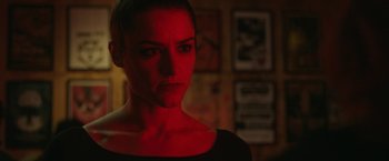 Movie still from “Life Itself” (2018), directed by Dan Fogelman – A person wearing a black shirt in a dark room; Close Up shot, Over the shoulder angle