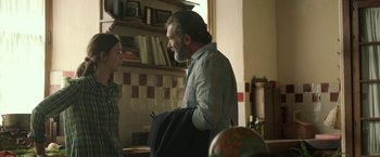 Movie still from “Life Itself” (2018), directed by Dan Fogelman – A man and a woman are talking in a kitchen; Medium shot, Over the shoulder angle