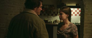 Movie still from “Life Itself” (2018), directed by Dan Fogelman – A man and a woman standing in a kitchen talking; Medium shot, Over the shoulder angle