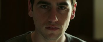 Movie still from “Life Itself” (2018), directed by Dan Fogelman – A young man's face; Close Up shot, Low angle