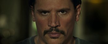 Movie still from “Life Itself” (2018), directed by Dan Fogelman – A person with a mustache; Close Up shot, Low angle