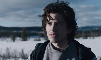 Movie still from “Light of My Life” (2019), directed by Casey Affleck – A young man in a gray shirt and a black jacket; Close Up shot, Over the shoulder angle