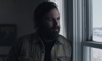 Movie still from “Light of My Life” (2019), directed by Casey Affleck – A man with a beard looking out of a window; Close Up shot, Low angle