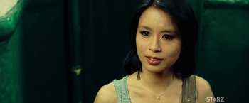 Movie still from “Limitless” (2011), directed by Neil Burger – A person wearing a necklace; Close Up shot, Over the shoulder angle