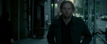 Movie still from “Limitless” (2011), directed by Neil Burger – A person wearing a jacket; Medium shot, Over the shoulder angle