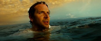 Movie still from “Limitless” (2011), directed by Neil Burger – A person in the water near a body of water; Close Up shot, Low angle