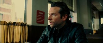 Movie still from “Limitless” (2011), directed by Neil Burger – A person wearing a leather jacket; Close Up shot, Over the shoulder angle