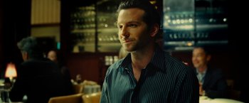 Movie still from “Limitless” (2011), directed by Neil Burger – A person wearing a dress shirt; Close Up shot, Over the shoulder angle