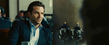 Movie still from “Limitless” (2011), directed by Neil Burger – A man in a suit sitting in front of a mirror; Close Up shot, Over the shoulder angle