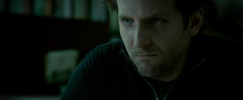 Movie still from “Limitless” (2011), directed by Neil Burger – A person wearing a sweater; Close Up shot, High angle