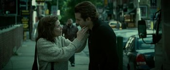 Movie still from “Limitless” (2011), directed by Neil Burger – A woman touching a man's face on the street; Close Up shot, Over the shoulder angle