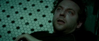 Movie still from “Limitless” (2011), directed by Neil Burger – A person with his eyes closed; Close Up shot, Overhead angle