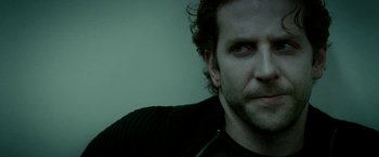 Movie still from “Limitless” (2011), directed by Neil Burger – A man's face in a black shirt; Close Up shot, High angle