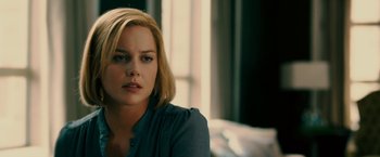 Movie still from “Limitless” (2011), directed by Neil Burger – A woman with blonde hair sitting in front of a window; Close Up shot, Over the shoulder angle