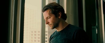 Movie still from “Limitless” (2011), directed by Neil Burger – A person looking out of a window; Close Up shot, Low angle