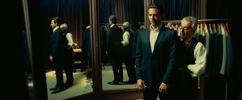 Movie still from “Limitless” (2011), directed by Neil Burger – A man in a suit in the mirror; Medium shot, Over the shoulder angle