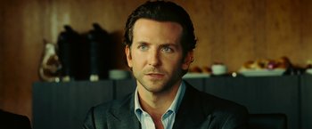 Movie still from “Limitless” (2011), directed by Neil Burger – A person wearing a suit and tie; Close Up shot, Over the shoulder angle