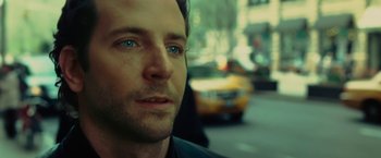 Movie still from “Limitless” (2011), directed by Neil Burger – A man's face in front of a yellow taxi cab; Close Up shot, Over the shoulder angle