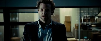 Movie still from “Limitless” (2011), directed by Neil Burger – A person wearing a suit and tie; Close Up shot, Over the shoulder angle