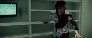 Movie still from “Limitless” (2011), directed by Neil Burger – A man with blood on his face and chest; Medium shot, Low angle