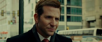 Movie still from “Limitless” (2011), directed by Neil Burger – A person wearing a suit and tie; Close Up shot, Over the shoulder angle