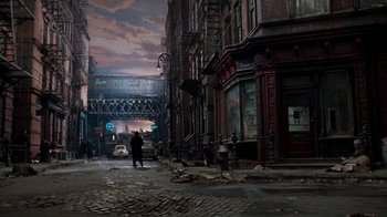 Movie still from “Little Shop of Horrors” (1986), directed by Frank Oz – A man walking down the street in a dark city; Extreme Wide shot, High angle