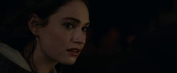 Movie still from “Little Woods” (2018), directed by Nia DaCosta – A woman's face in the dark; Close Up shot, Over the shoulder angle