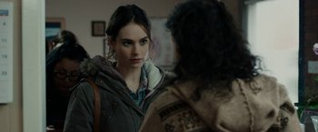 Movie still from “Little Woods” (2018), directed by Nia DaCosta – A woman looking at another woman in front of a mirror; Close Up shot, Over the shoulder angle
