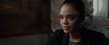 Movie still from “Little Woods” (2018), directed by Nia DaCosta – A person wearing a jacket; Close Up shot, Over the shoulder angle