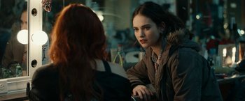Movie still from “Little Woods” (2018), directed by Nia DaCosta – A woman sitting next to another woman at a table; Close Up shot, Over the shoulder angle