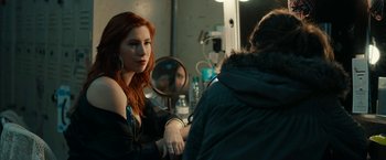 Movie still from “Little Woods” (2018), directed by Nia DaCosta – A woman sitting in front of a mirror in a dressing room; Medium shot, Over the shoulder angle