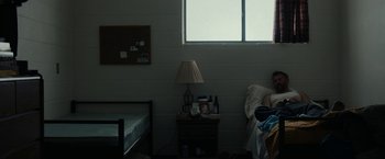 Movie still from “Little Woods” (2018), directed by Nia DaCosta – A bed room with a bed and a nightstand; Wide shot, High angle