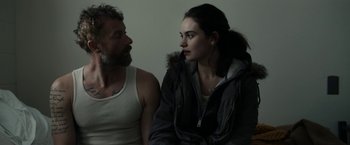 Movie still from “Little Woods” (2018), directed by Nia DaCosta – A man and a woman sitting next to each other; Close Up shot, Over the shoulder angle