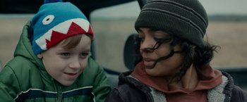 Movie still from “Little Woods” (2018), directed by Nia DaCosta – A woman sitting next to a child in a car; Close Up shot, Over the shoulder angle