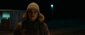 Movie still from “Little Woods” (2018), directed by Nia DaCosta – A young woman wearing a winter coat and a hat; Close Up shot, Over the shoulder angle