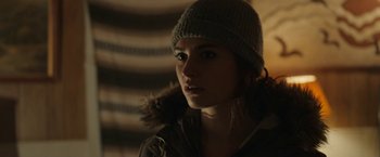 Movie still from “Little Woods” (2018), directed by Nia DaCosta – A woman wearing a hat with a fur pom - pom; Close Up shot, Over the shoulder angle