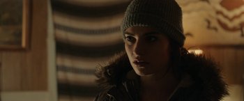 Movie still from “Little Woods” (2018), directed by Nia DaCosta – A woman wearing a hat and a jacket; Close Up shot, Over the shoulder angle