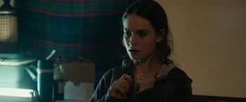 Movie still from “Little Woods” (2018), directed by Nia DaCosta – A young woman is looking into the distance; Close Up shot, Over the shoulder angle