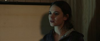 Movie still from “Little Woods” (2018), directed by Nia DaCosta – A young woman is looking into the distance; Close Up shot, Over the shoulder angle