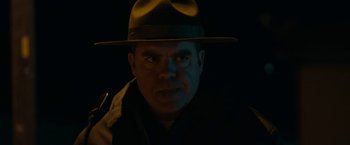 Movie still from “Little Woods” (2018), directed by Nia DaCosta – A man wearing a hat in the dark; Close Up shot, Low angle