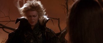 Movie still from “Labyrinth” (1986), directed by Jim Henson – A person wearing a wig; Close Up shot, Over the shoulder angle