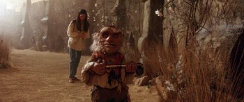 Movie still from “Labyrinth” (1986), directed by Jim Henson – A man holding a stick in his hand; Wide shot, High angle