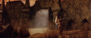 Movie still from “Labyrinth” (1986), directed by Jim Henson – A woman and a little boy in a cave; Wide shot, High angle
