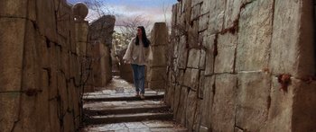 Movie still from “Labyrinth” (1986), directed by Jim Henson – A woman walking down a set of stairs; Wide shot, Low angle