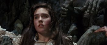 Movie still from “Labyrinth” (1986), directed by Jim Henson – A young woman with long dark brown hair; Close Up shot, Over the shoulder angle