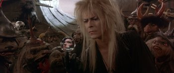 Movie still from “Labyrinth” (1986), directed by Jim Henson – Jareth the goblin king looking at himself in a mirror; Close Up shot, Over the shoulder angle